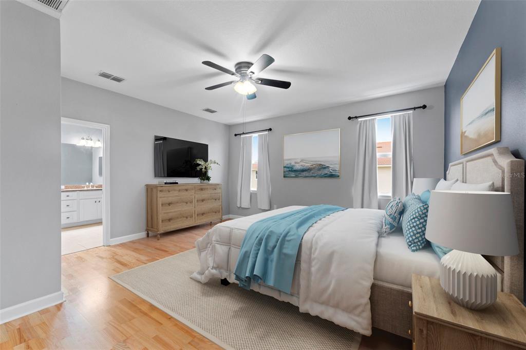 1264 Riserva Lane Palm Harbor, FL 34683 - Photo 10 of 28 a bedroom with a bed window and a television