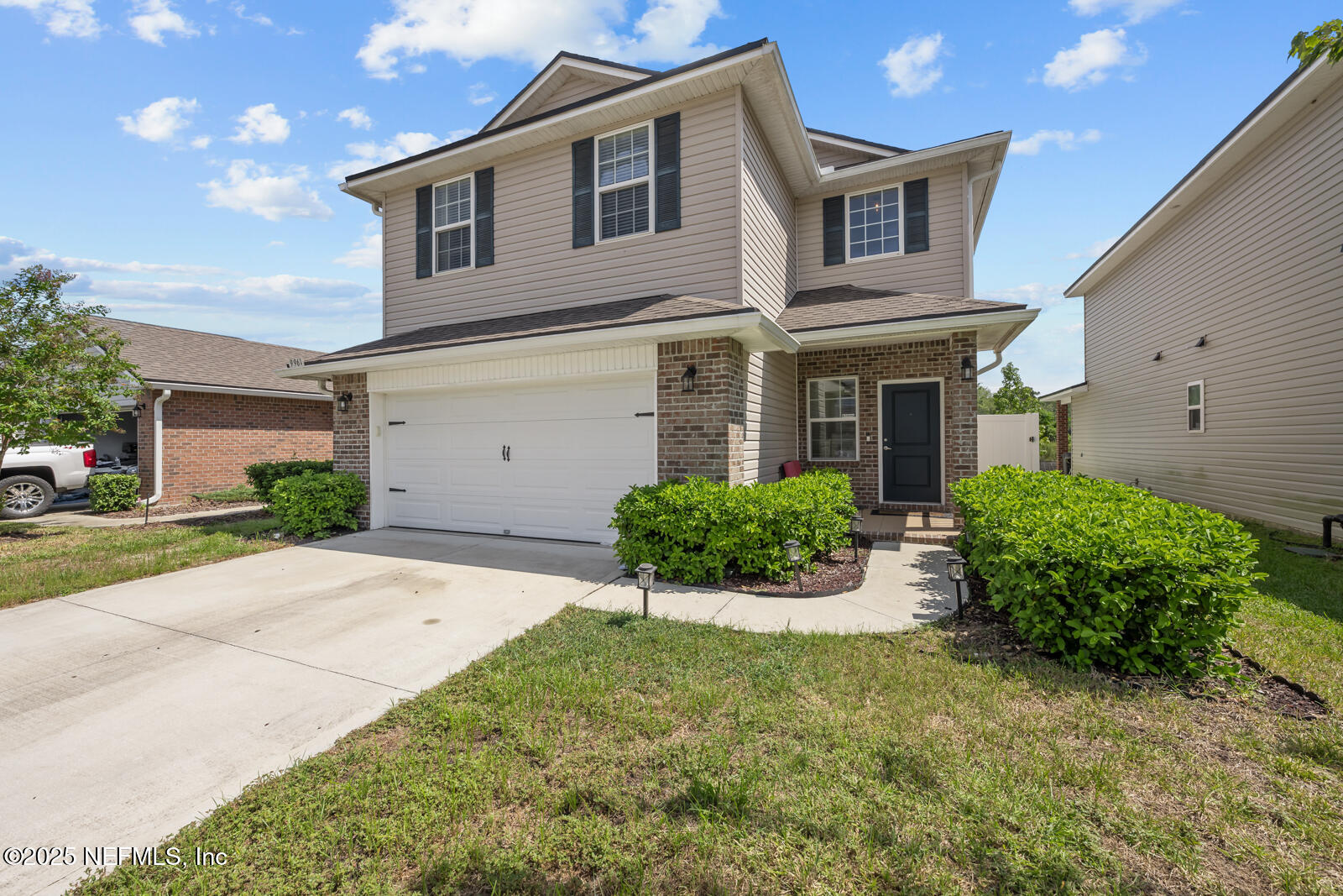9961 Redfish Marsh Circle Jacksonville, FL 32219 - Photo 1 of 37 a front view of a house with garden