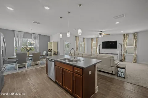 a kitchen with counter space and breakfast area