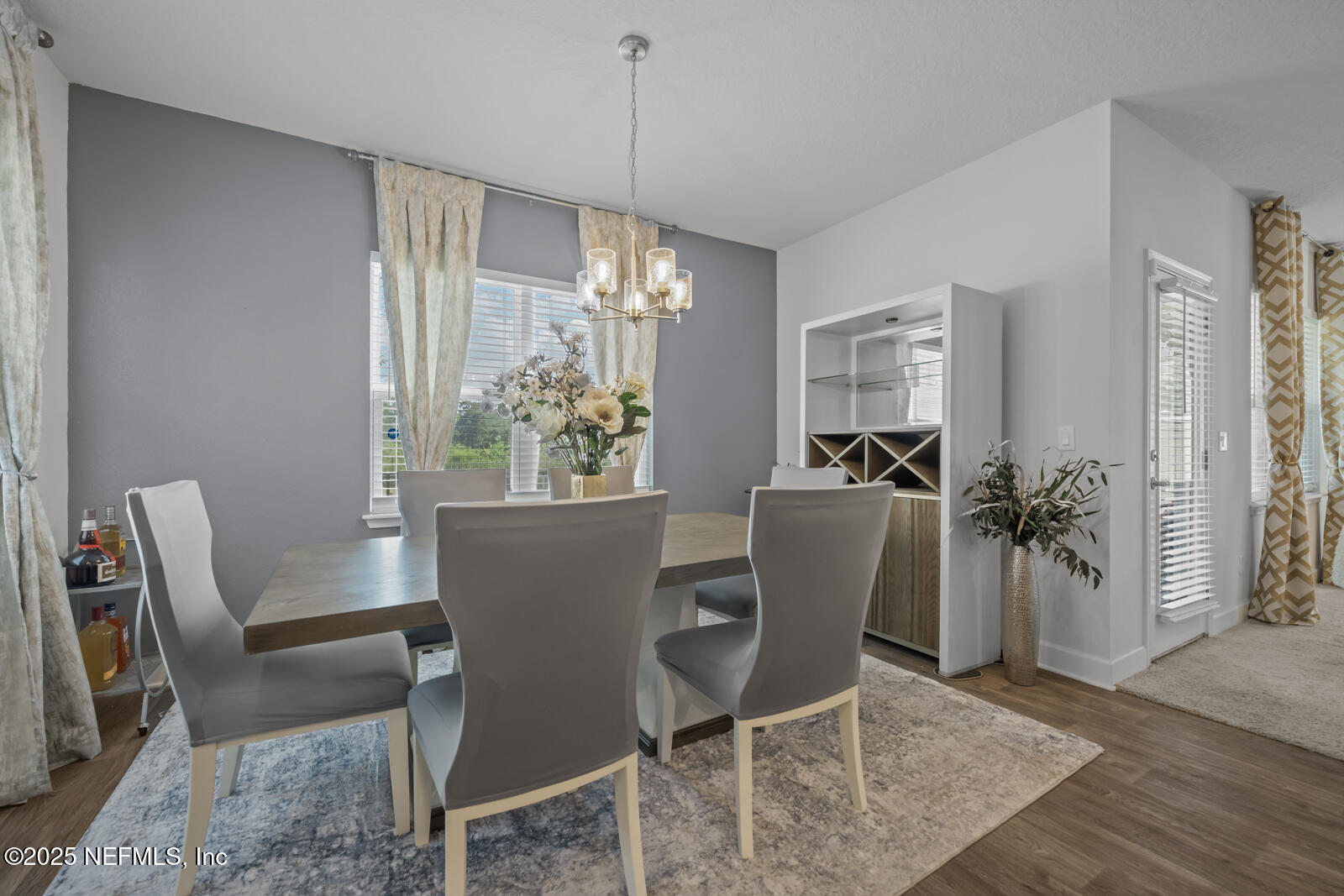 9961 Redfish Marsh Circle Jacksonville, FL 32219 - Photo 18 of 37 a view of a dining room with furniture and chandelier