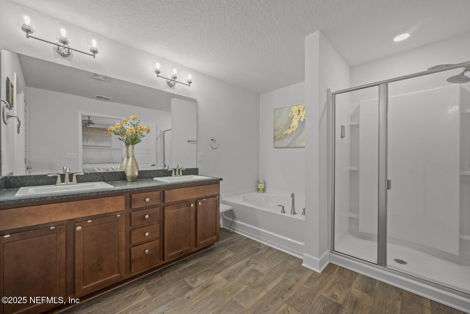 9961 Redfish Marsh Circle Jacksonville, FL 32219 - Photo 21 of 37 a spacious bathroom with a double vanity sink a large mirror and shower