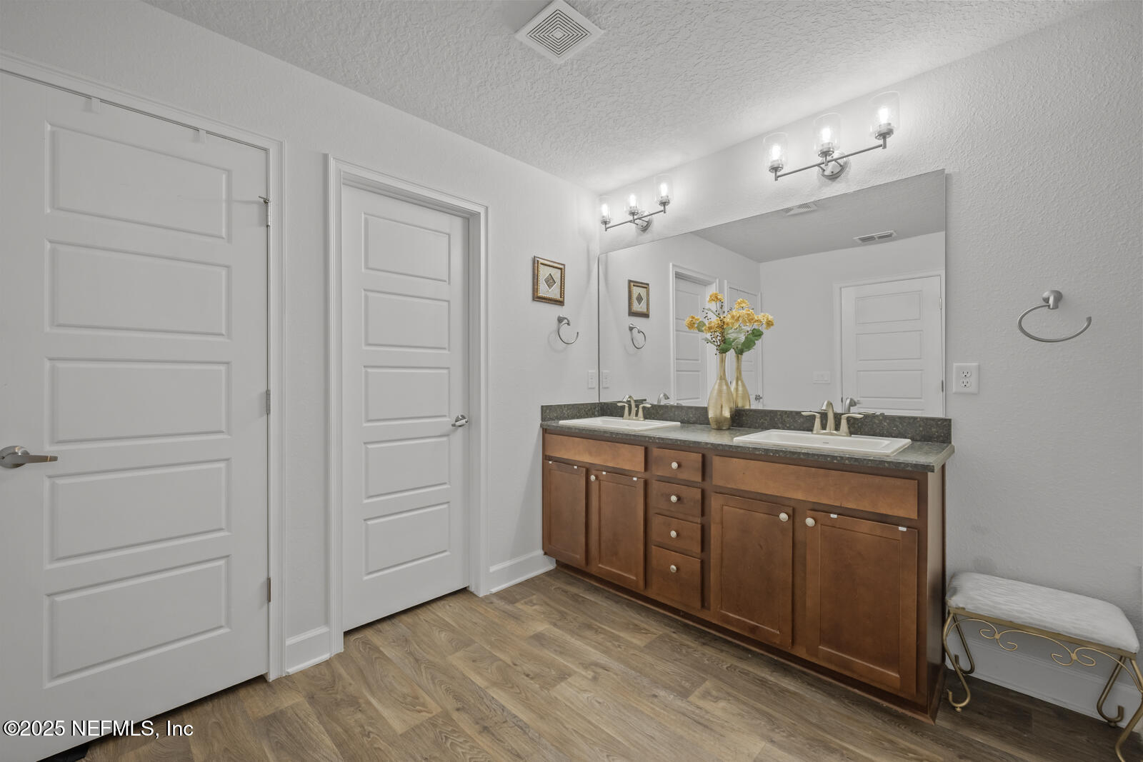 9961 Redfish Marsh Circle Jacksonville, FL 32219 - Photo 22 of 37 a spacious bathroom with a granite countertop sink a mirror and a vanity
