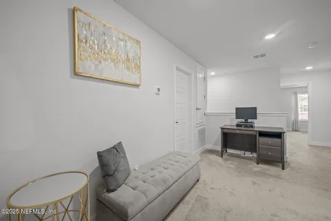 a living room with furniture a couch and a piano