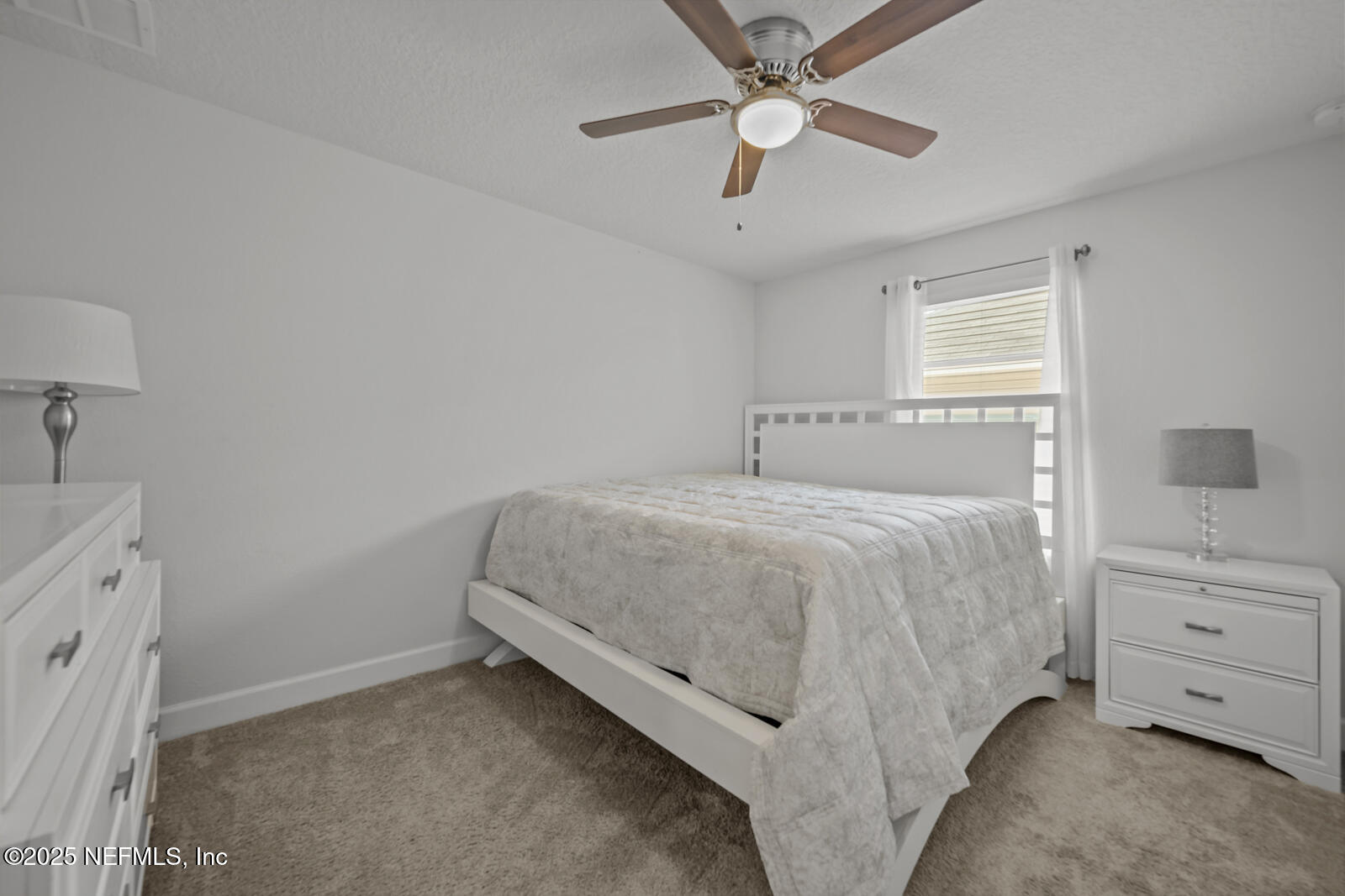 9961 Redfish Marsh Circle Jacksonville, FL 32219 - Photo 24 of 37 a spacious bedroom with a bed and a cabinets