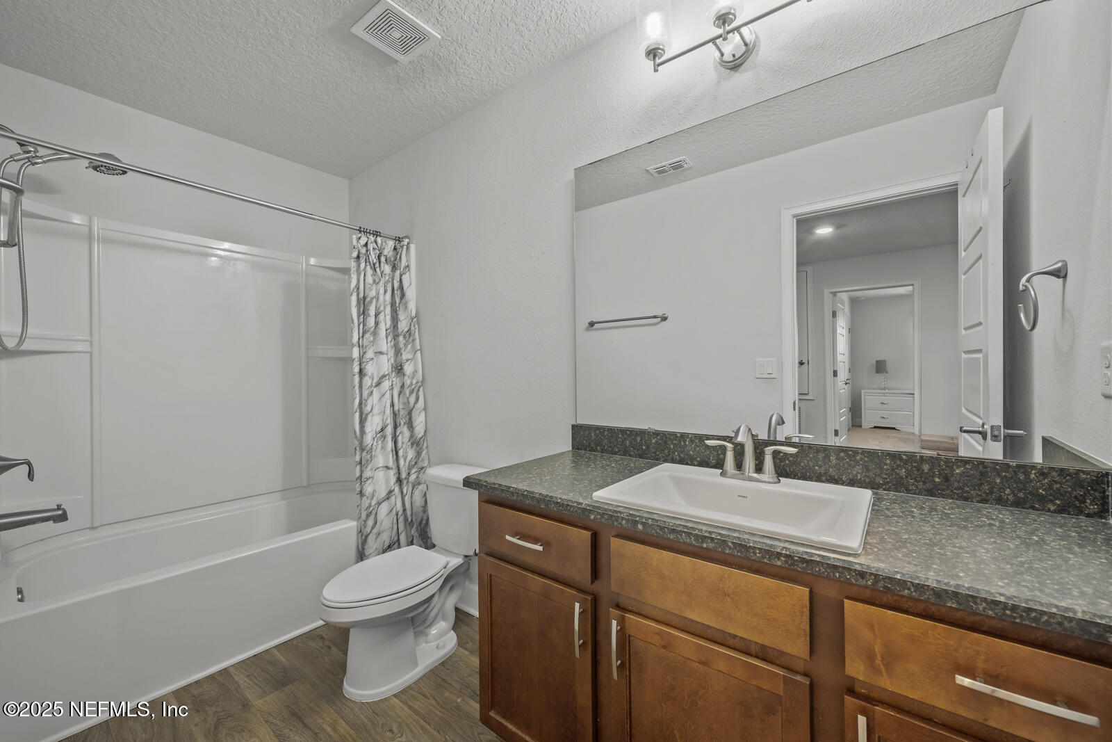 9961 Redfish Marsh Circle Jacksonville, FL 32219 - Photo 25 of 37 a bathroom with a granite countertop sink toilet and shower