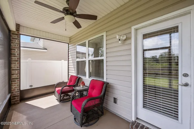 a balcony with furniture and window