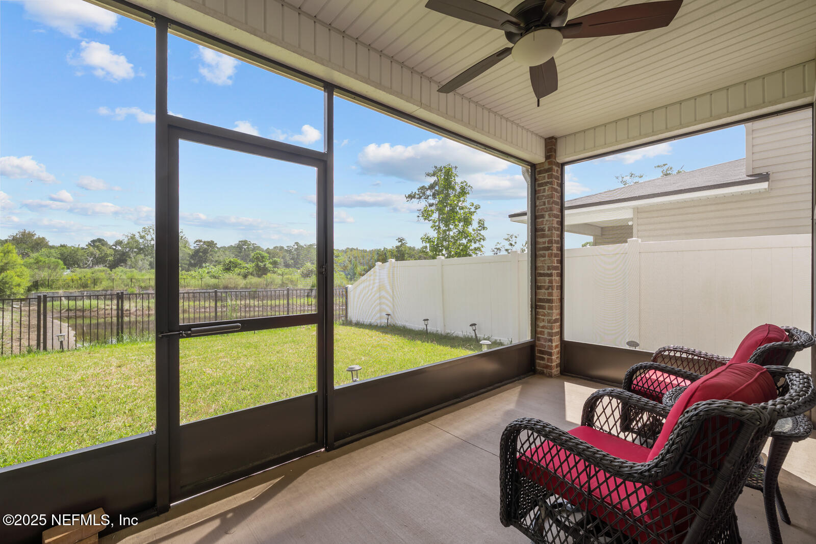 9961 Redfish Marsh Circle Jacksonville, FL 32219 - Photo 29 of 37 a living room with furniture and a large window