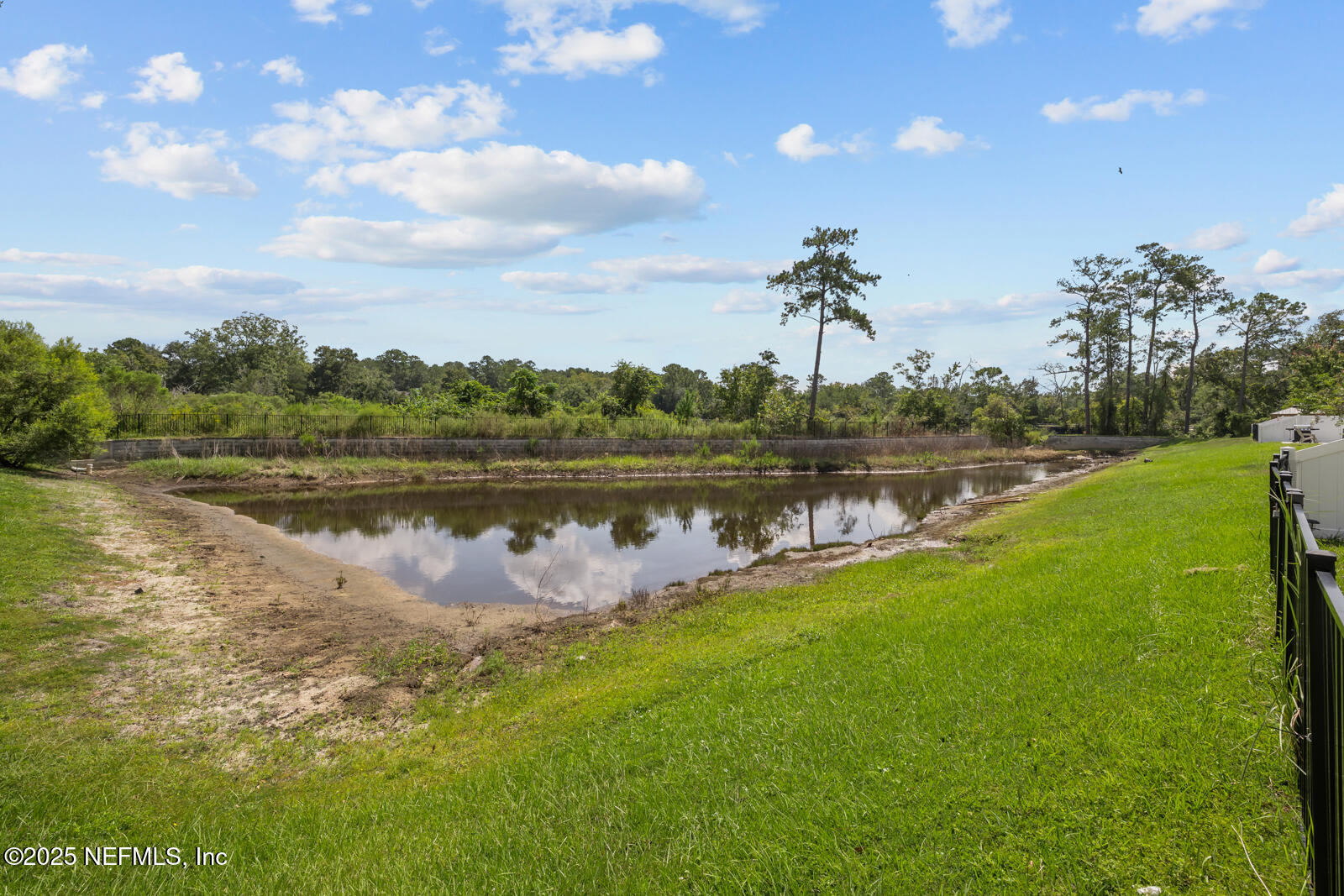 9961 Redfish Marsh Circle Jacksonville, FL 32219 - Photo 32 of 37 a view of a lake with houses in the back