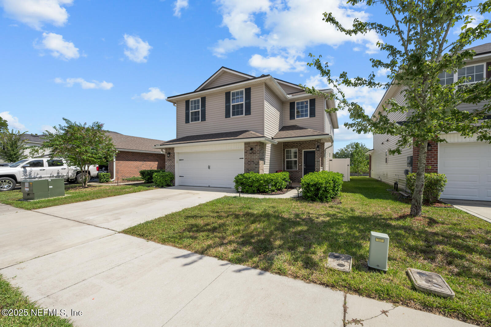 9961 Redfish Marsh Circle Jacksonville, FL 32219 - Photo 35 of 37 a front view of a house with a garden
