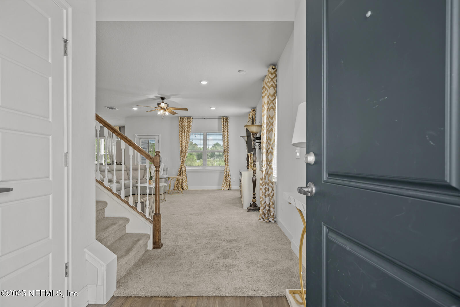 9961 Redfish Marsh Circle Jacksonville, FL 32219 - Photo 4 of 37 a view of a hallway with wooden floor and entryway