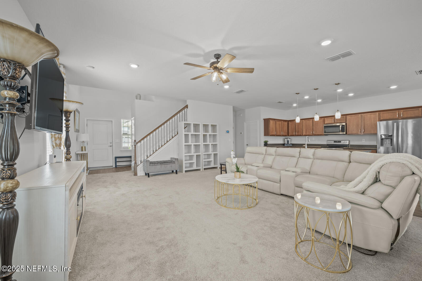 9961 Redfish Marsh Circle Jacksonville, FL 32219 - Photo 6 of 37 a living room with furniture and a flat screen tv