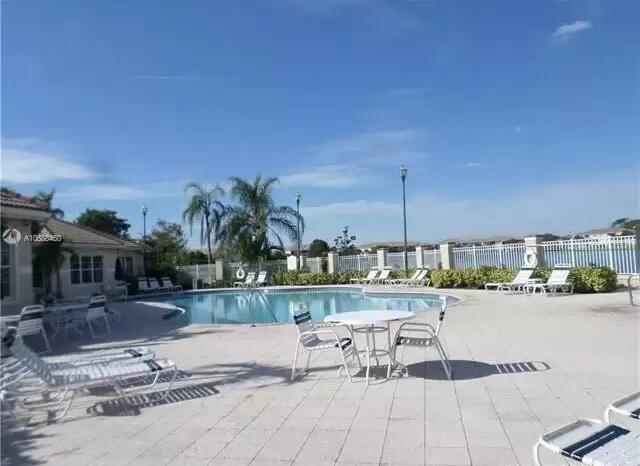 5045 Wiles Road, Unit 308 Coconut Creek, FL 33073 - Photo 3 of 9 EVERGREEN POOL