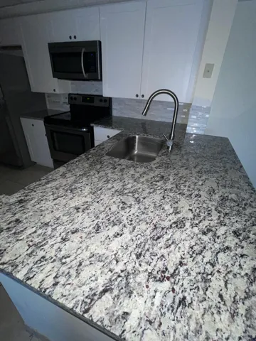 $290,000 | 5045 Wiles Road, Unit 308, Coconut Creek, FL 33073