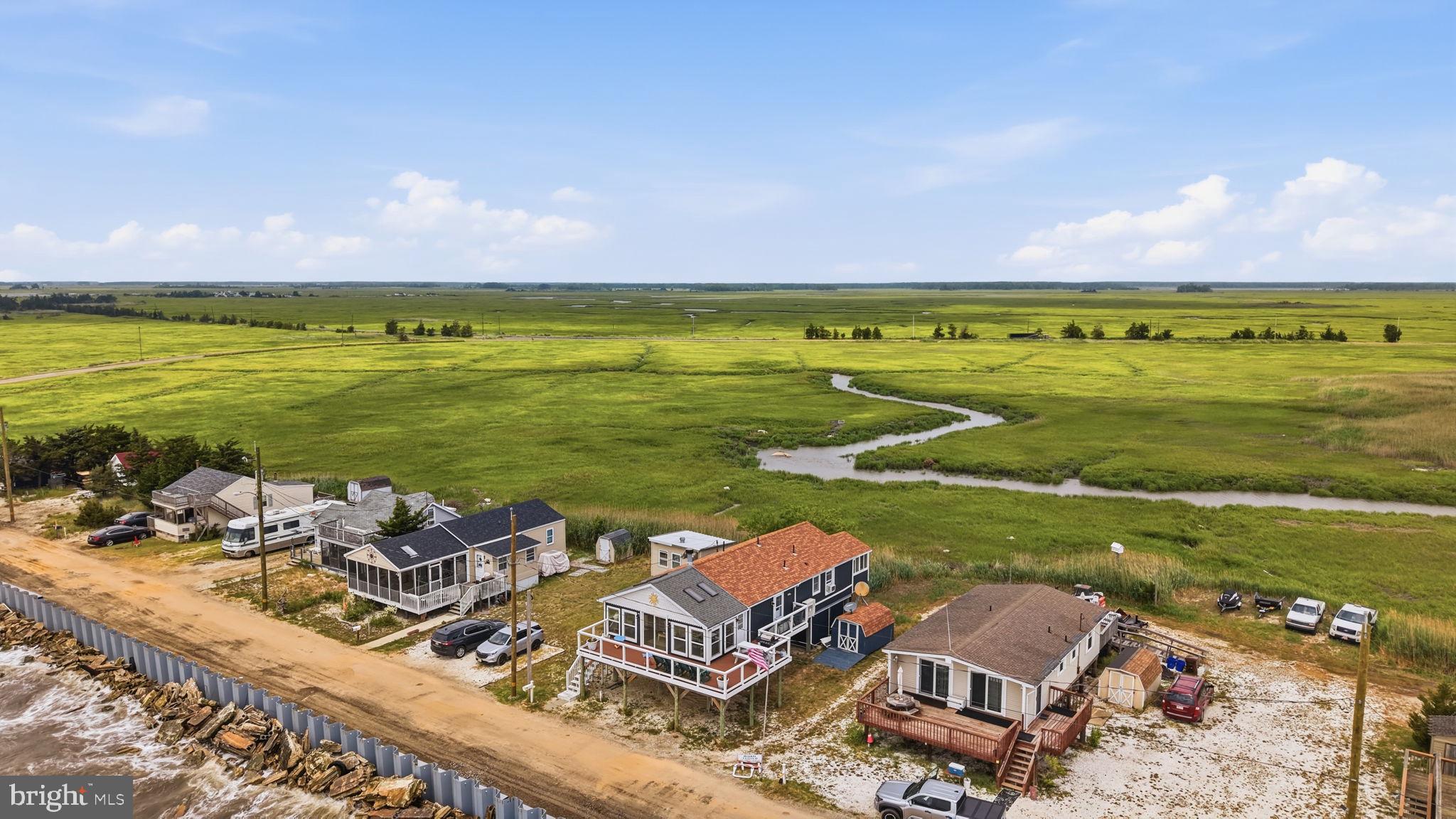 173 Cove Road Newport, NJ 08345 - Photo 56 of 72 a view of a ocean with beach and ocean view