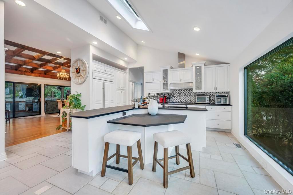 30 Fox Hollow Ridings Road Northport, NY 11768 - Photo 14 of 50 a kitchen with stainless steel appliances granite countertop a stove a sink and a refrigerator