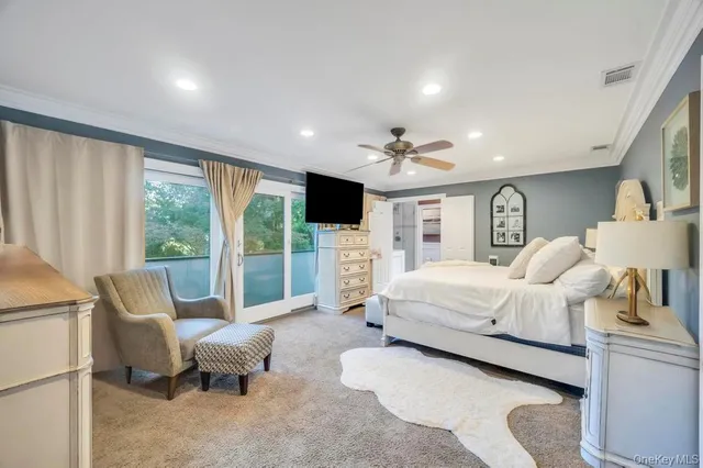 a reading room with lots of furniture and a book shelf