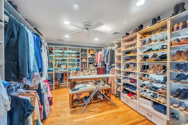 a living room with furniture and large windows