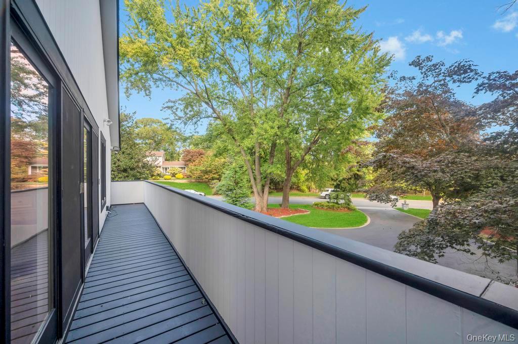 30 Fox Hollow Ridings Road Northport, NY 11768 - Photo 19 of 50 a view of a balcony with mountain view