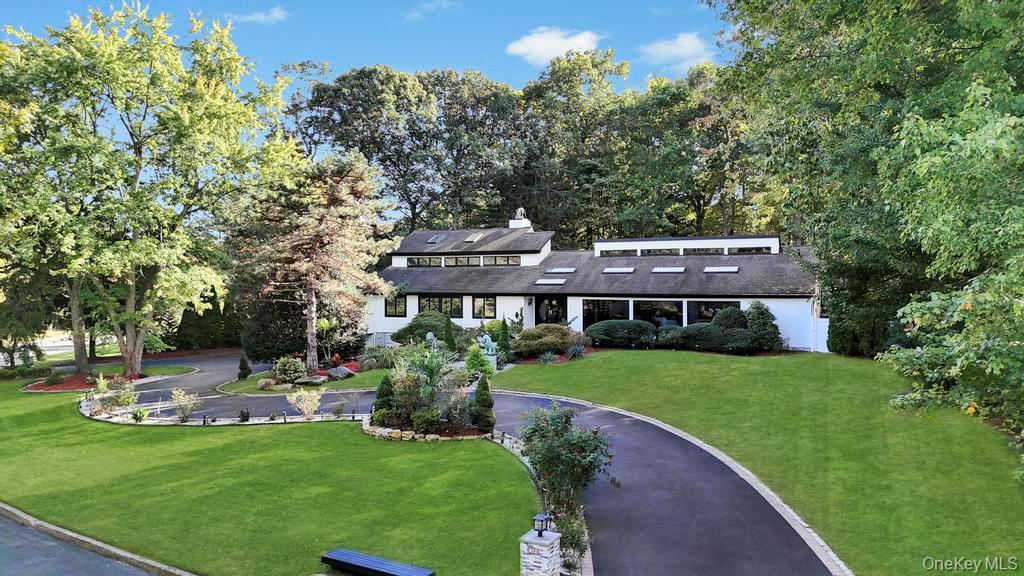 30 Fox Hollow Ridings Road Northport, NY 11768 - Photo 2 of 50 a view of a house with a garden