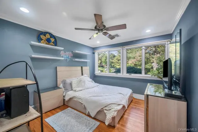 a bathroom with a granite countertop sink mirror vanity and toilet