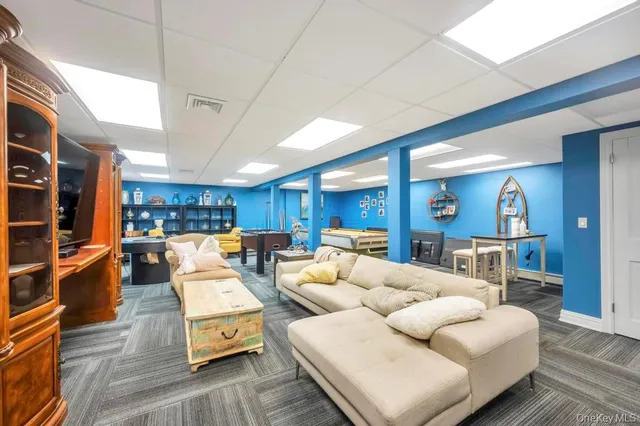 a living room with furniture and a table