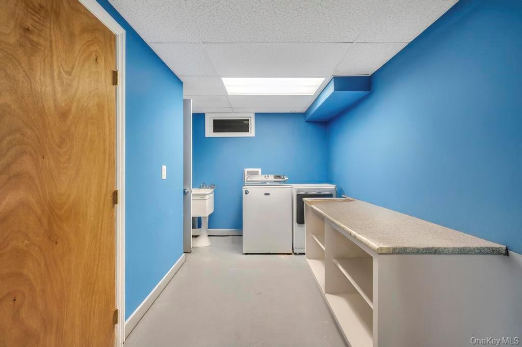30 Fox Hollow Ridings Road Northport, NY 11768 - Photo 33 of 50 a utility room with dryer and washer