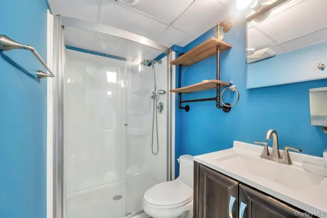 a bedroom with two beds and a flat screen tv