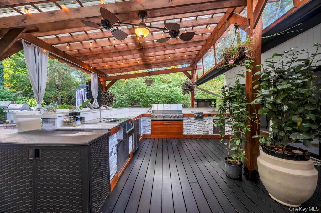 30 Fox Hollow Ridings Road Northport, NY 11768 - Photo 38 of 50 a kitchen with stainless steel appliances granite countertop a sink and wooden floors