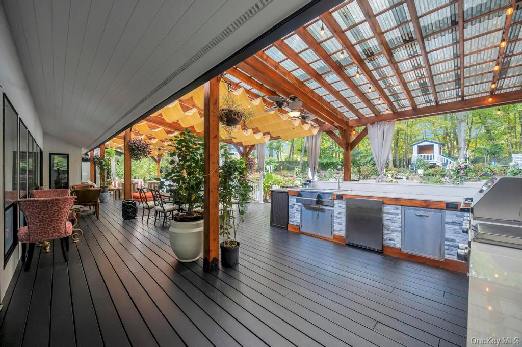 30 Fox Hollow Ridings Road Northport, NY 11768 - Photo 39 of 50 a view of a living room with a large window and wooden floor