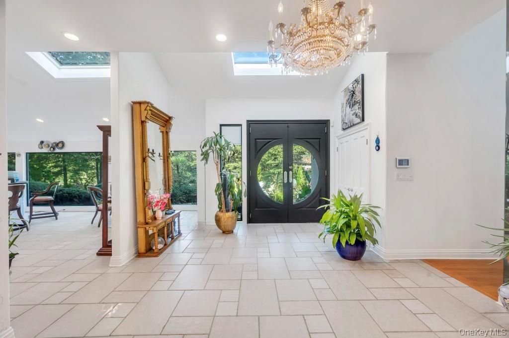 30 Fox Hollow Ridings Road Northport, NY 11768 - Photo 4 of 50 a view of an entryway with wooden floor