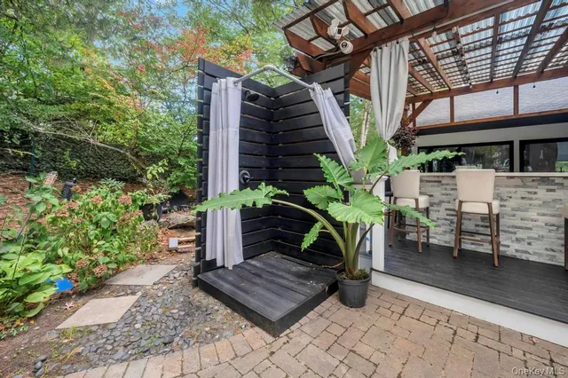 a view of a patio in the backyard