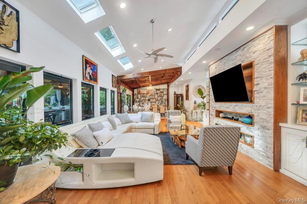 30 Fox Hollow Ridings Road Northport, NY 11768 - Photo 6 of 50 a living room with furniture and a flat screen tv