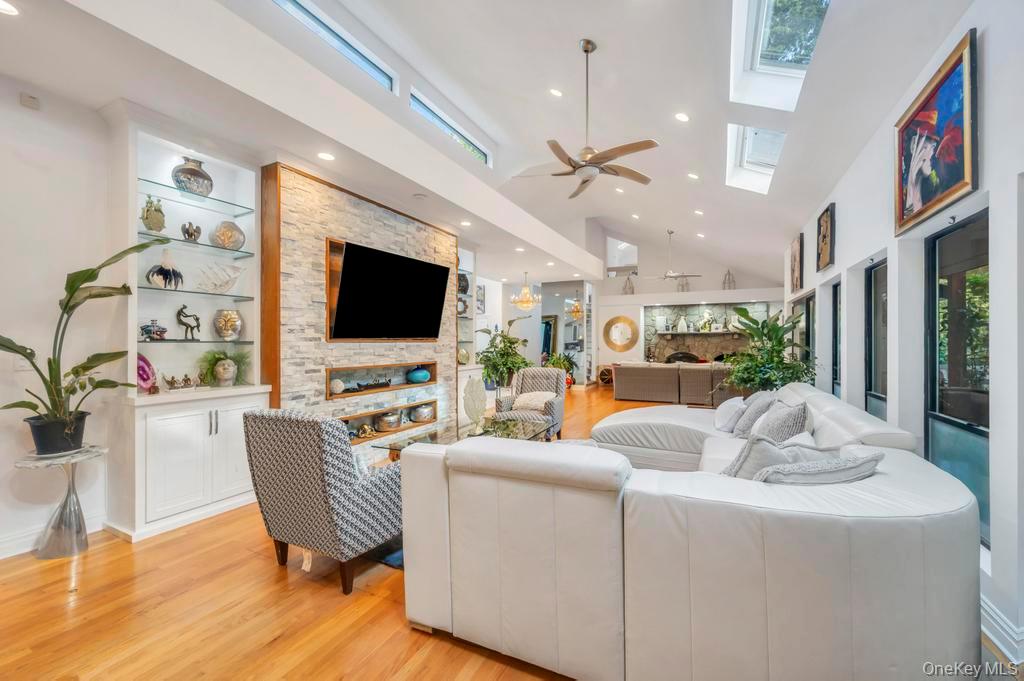 30 Fox Hollow Ridings Road Northport, NY 11768 - Photo 8 of 50 a living room with fireplace furniture and a flat screen tv
