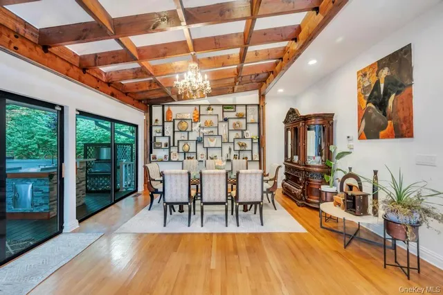 a view of a dining room with furniture water and mountain view
