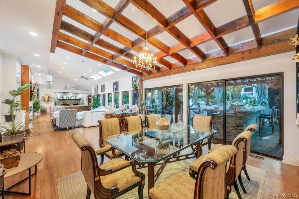 30 Fox Hollow Ridings Road Northport, NY 11768 - Photo 10 of 50 a view of a dining room with furniture water and mountain view