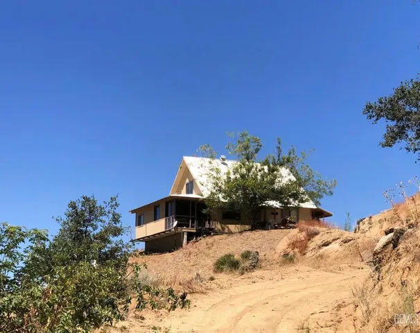a view of a backyard of the house