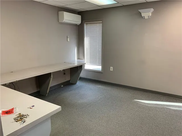 a bathroom with a sink toilet and a mirror