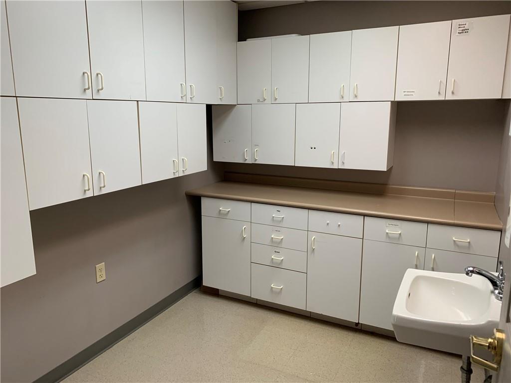 4 Peartree Way Beaver, PA 15009 - Photo 16 of 24 a kitchen with granite countertop white cabinets and sink