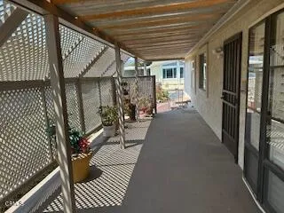 a view of a balcony with wooden floor