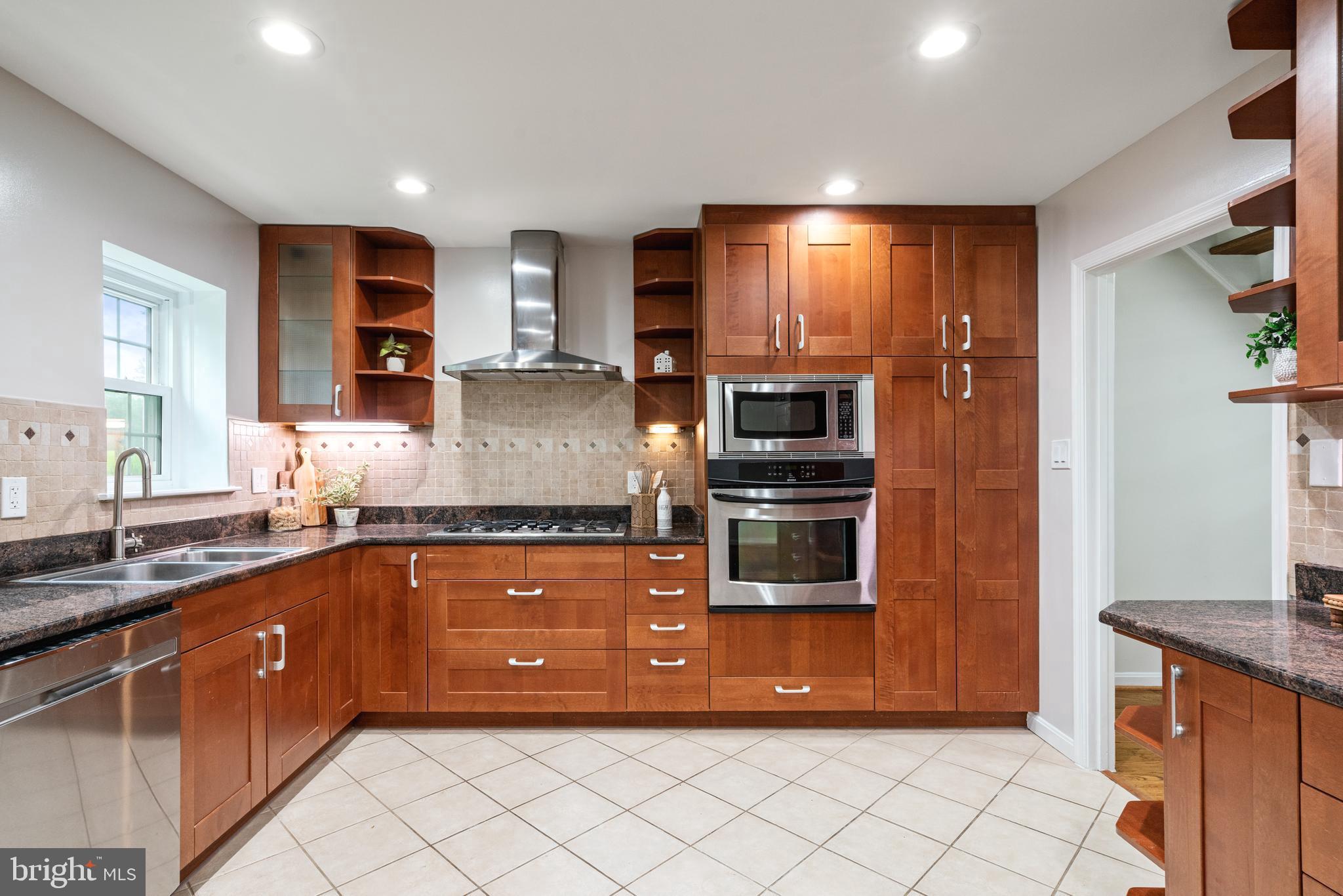 2192 Golf Course Drive Reston, VA 20191 - Photo 11 of 125 a large kitchen with stainless steel appliances granite countertop a refrigerator and a sink