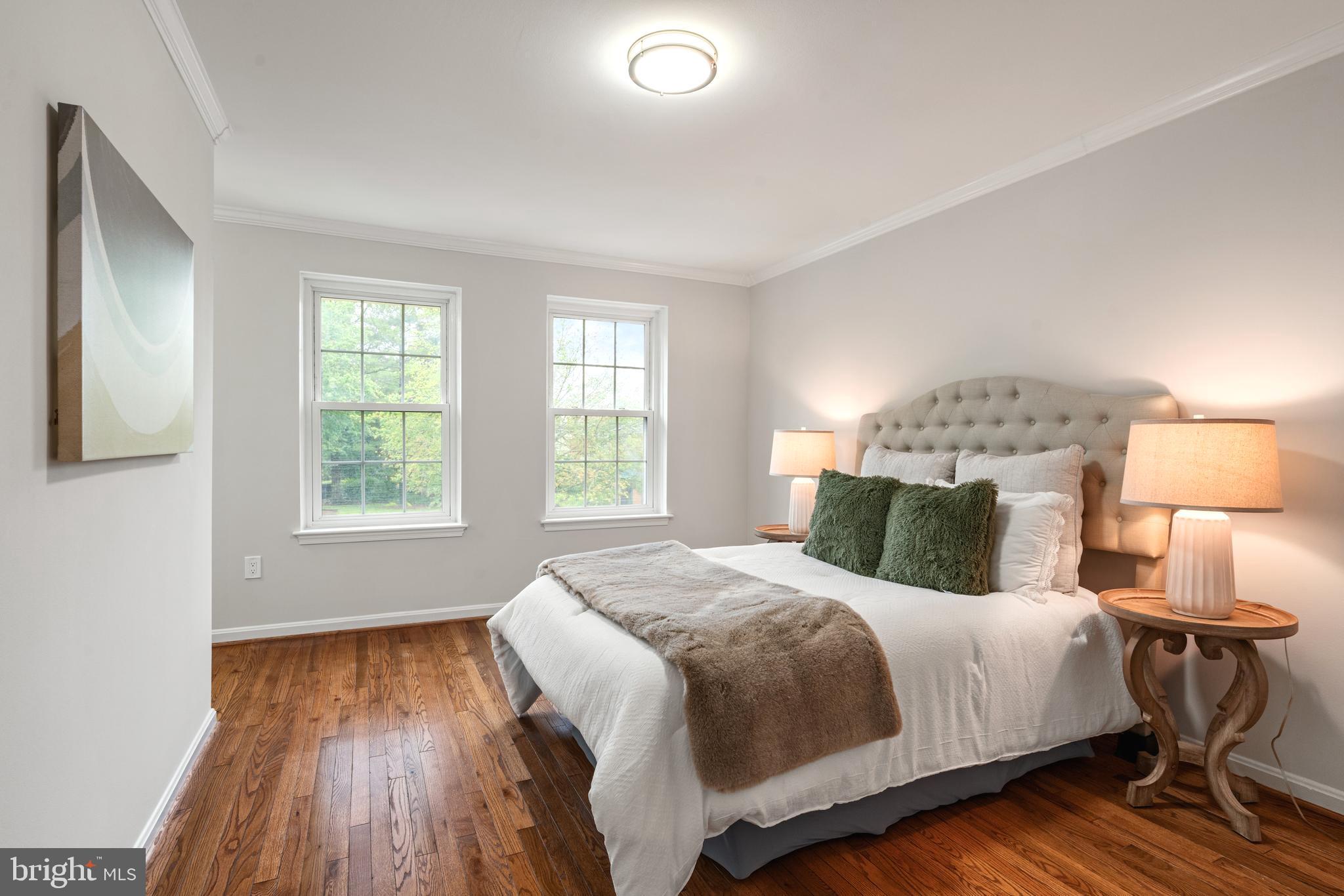 2192 Golf Course Drive Reston, VA 20191 - Photo 15 of 125 a bedroom with a bed and a lamp