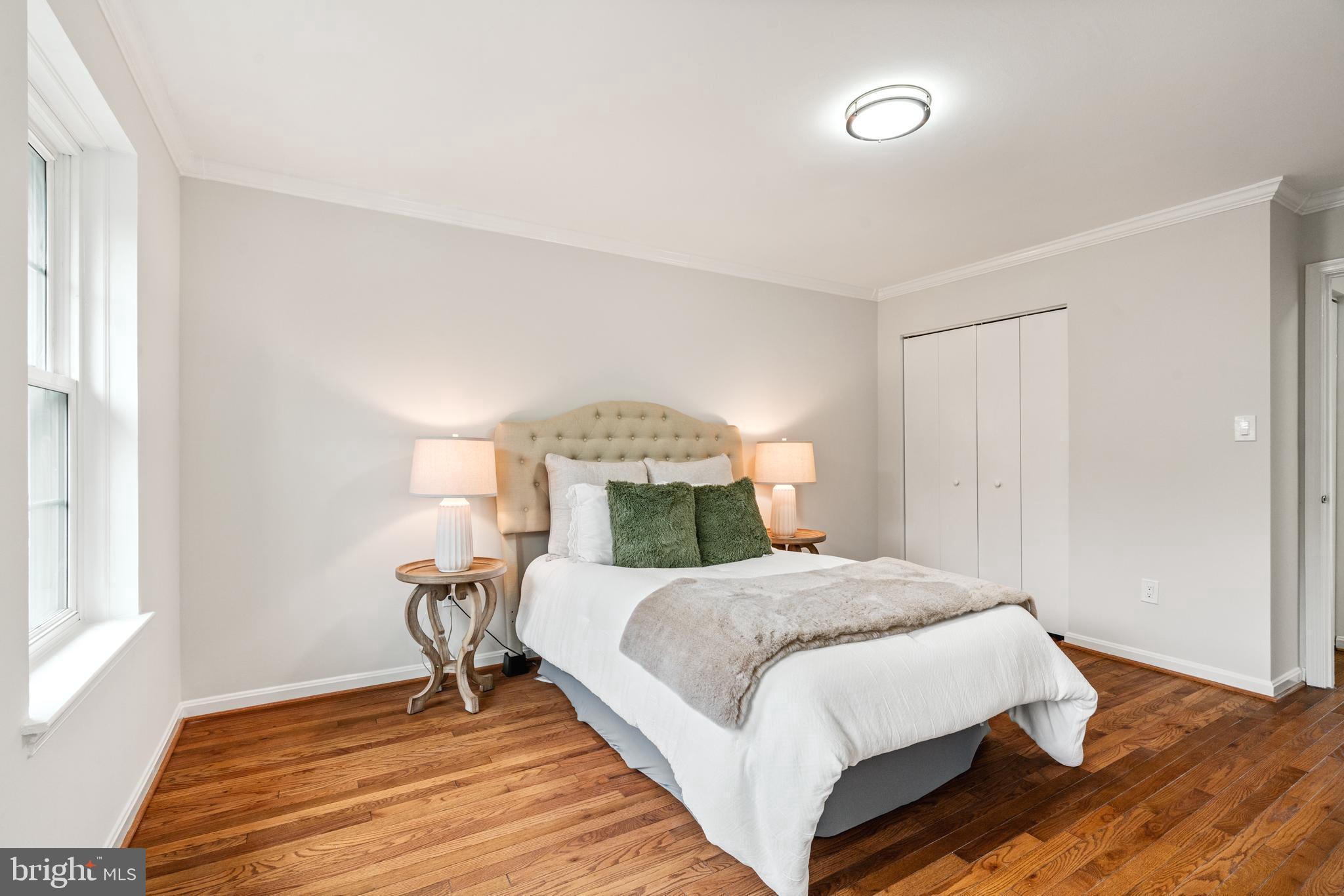 2192 Golf Course Drive Reston, VA 20191 - Photo 17 of 125 a bedroom with a bed and wooden floor