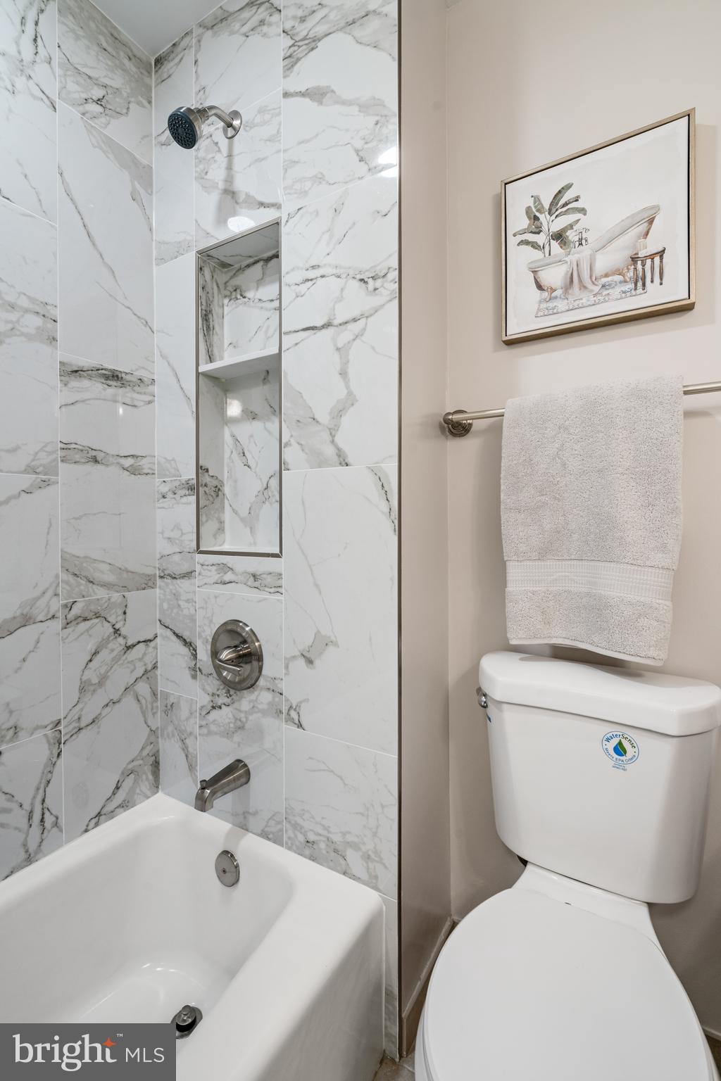 2192 Golf Course Drive Reston, VA 20191 - Photo 20 of 125 a white toilet sitting next to a bath tub