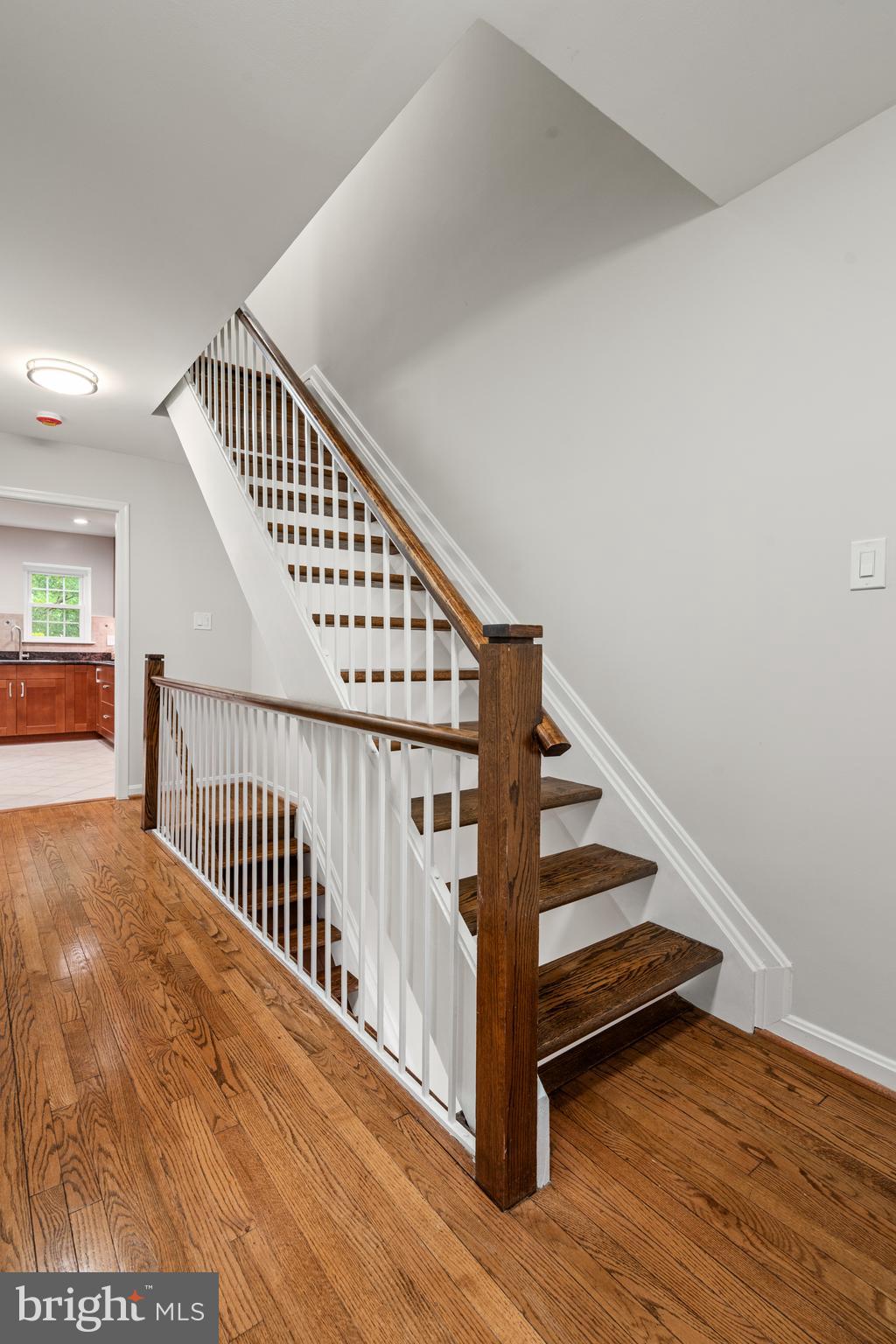 2192 Golf Course Drive Reston, VA 20191 - Photo 28 of 125 a view of staircase with wooden floor and white walls