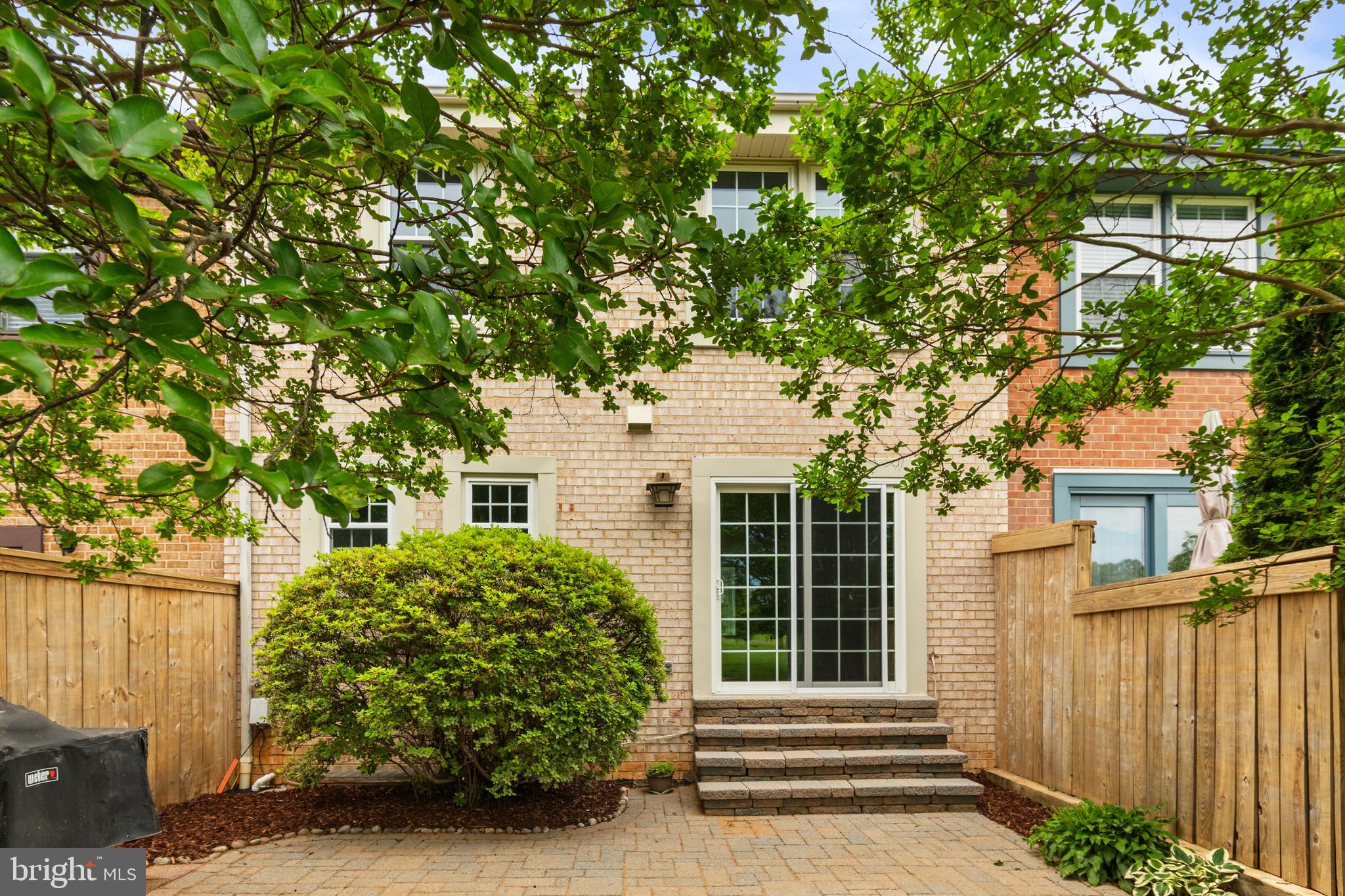 2192 Golf Course Drive Reston, VA 20191 - Photo 42 of 125 a front view of a house with a tree