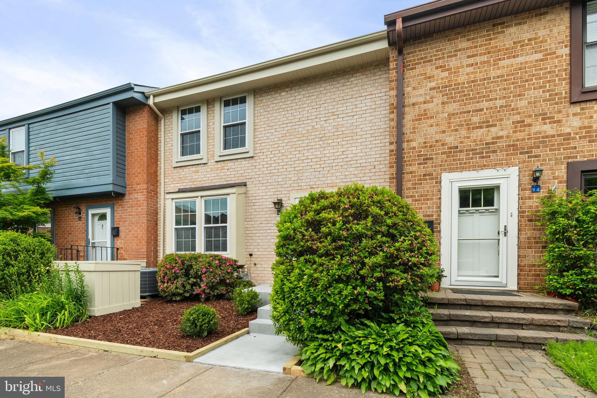 2192 Golf Course Drive Reston, VA 20191 - Photo 49 of 125 a front view of a house with a garden