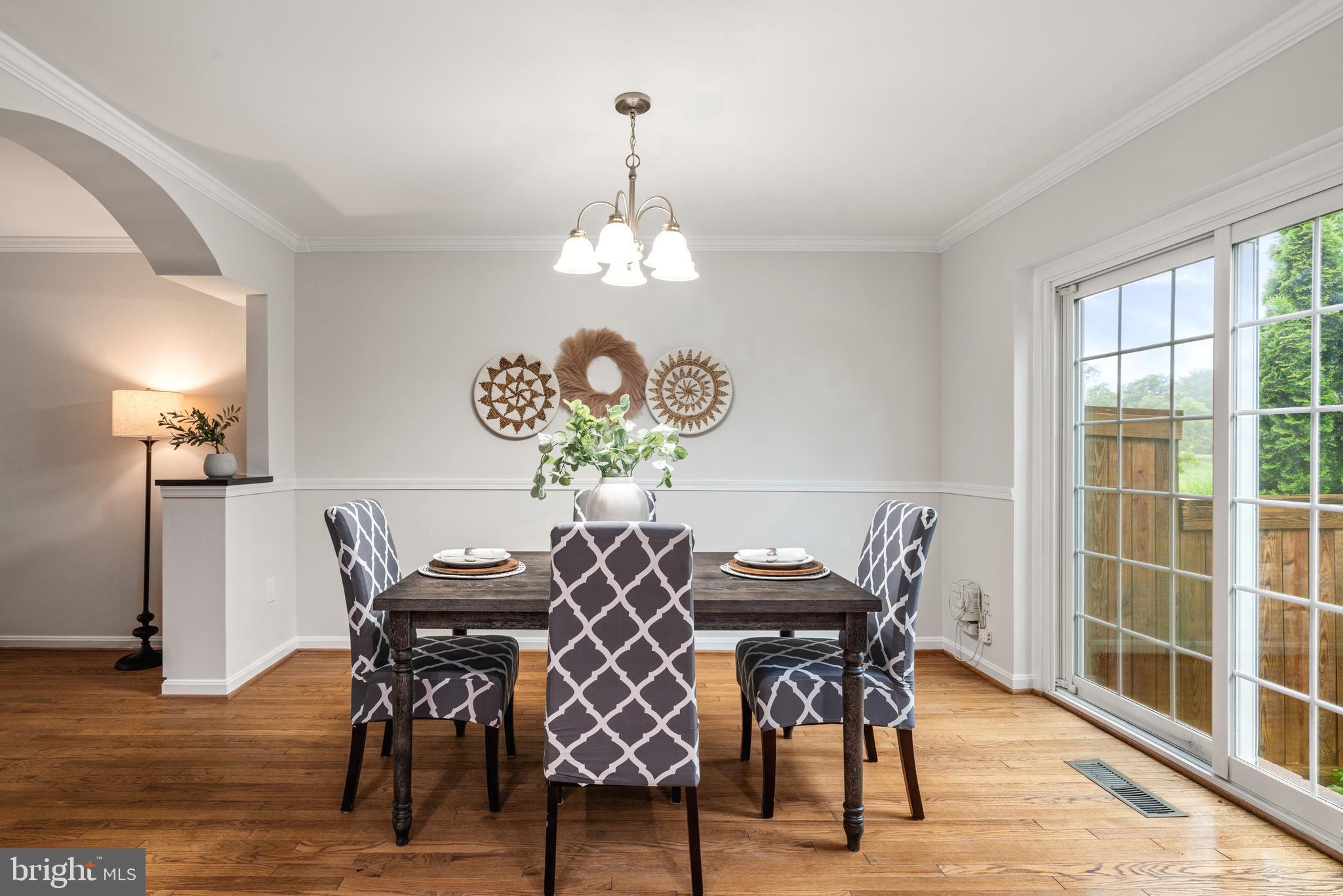 2192 Golf Course Drive Reston, VA 20191 - Photo 8 of 125 a view of a dining room with furniture window and wooden floor