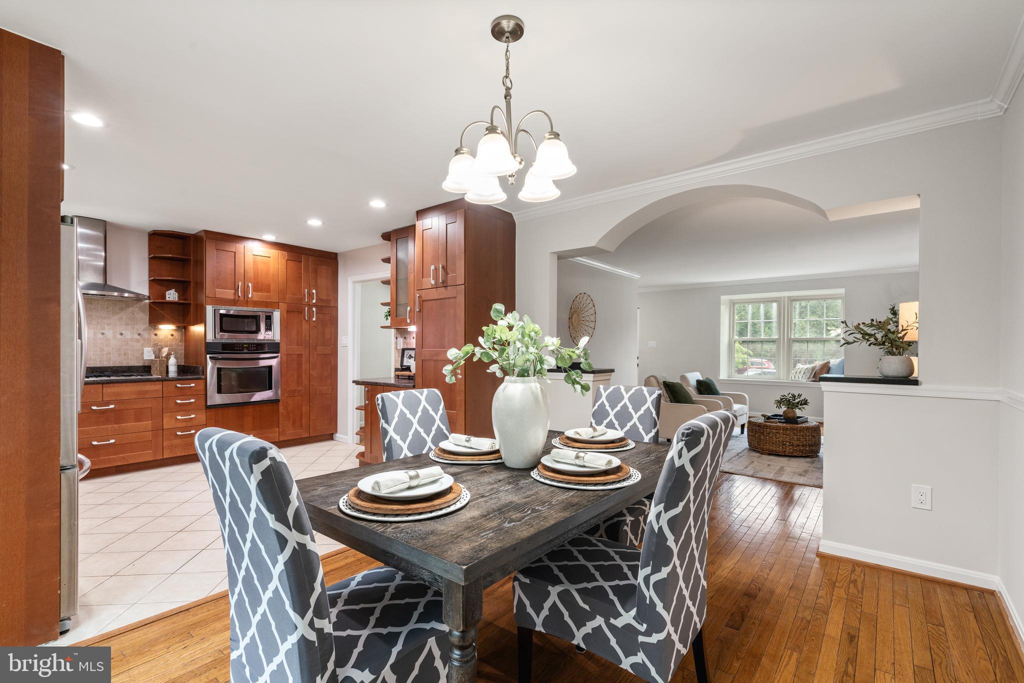 2192 Golf Course Drive Reston, VA 20191 - Photo 9 of 125 a view of a dining room with furniture wooden floor and chandelier