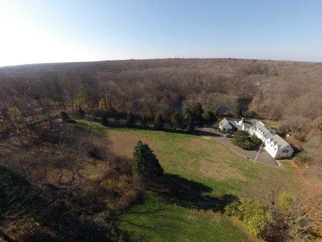 329 Chestnut Hill Road Norwalk, CT 06851 - Photo 1 of 1 a view of a lake in middle of the forest