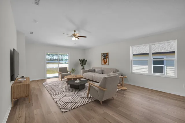 a living room with furniture or window and a wooden floor